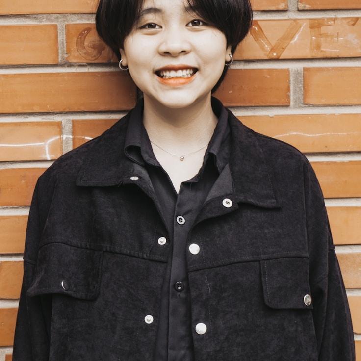 Kaveri Mehta, Lead Design Curator at Corner Ticket Source, reviewing corporate floral arrangements